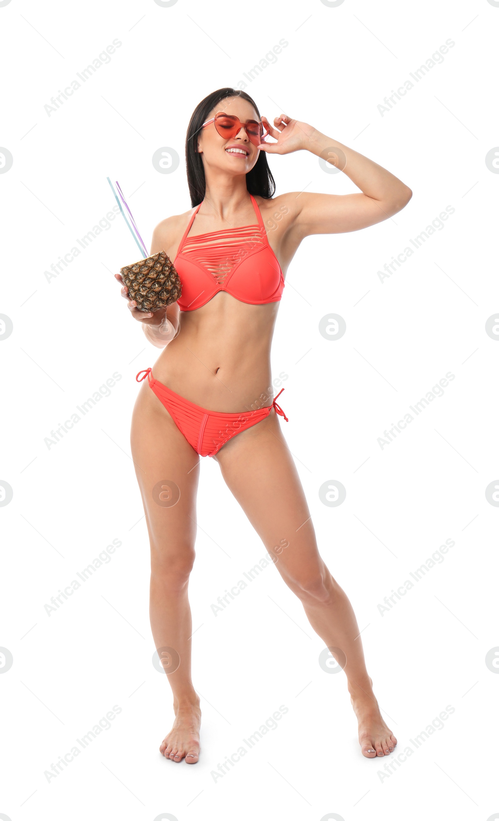 Photo of Beautiful young woman in stylish bikini with cocktail on white background