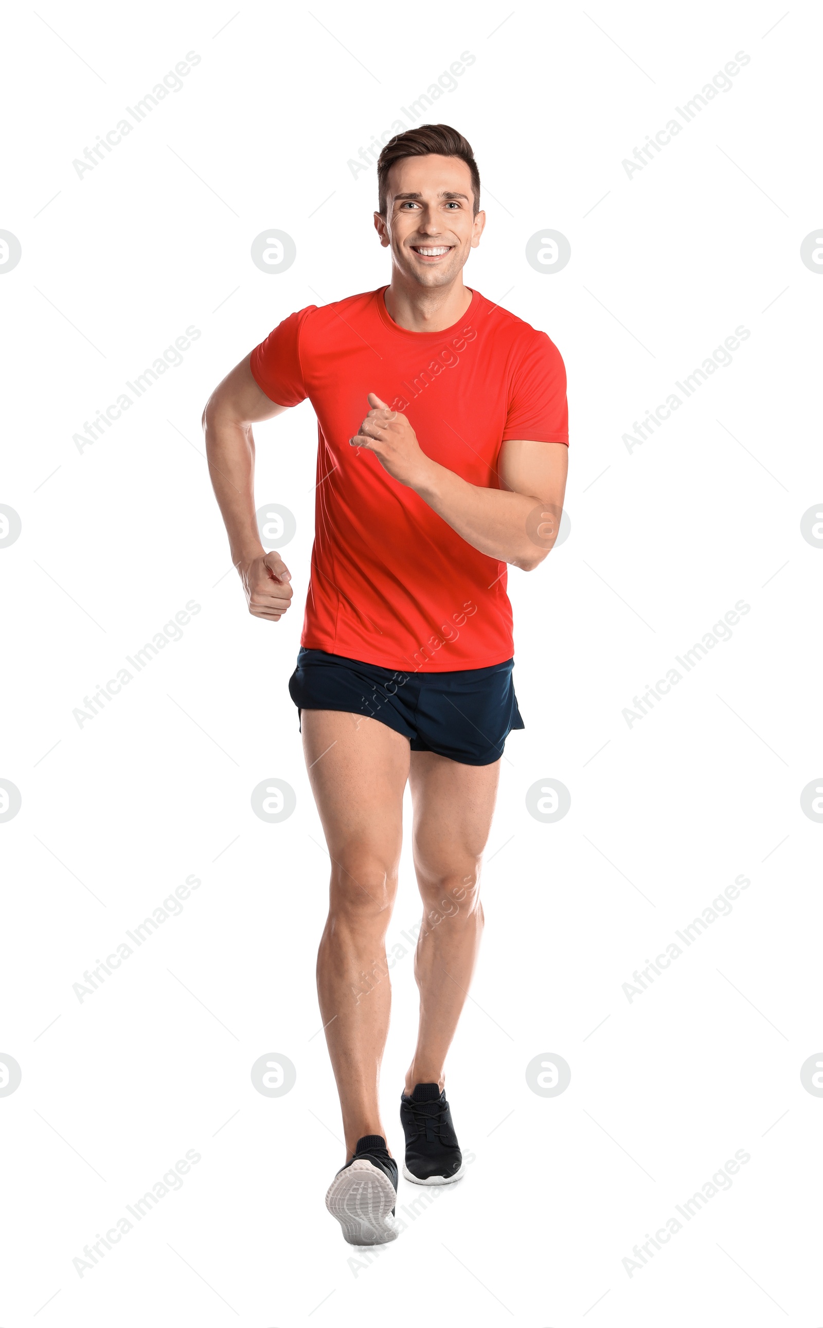 Photo of Sporty young man running on white background