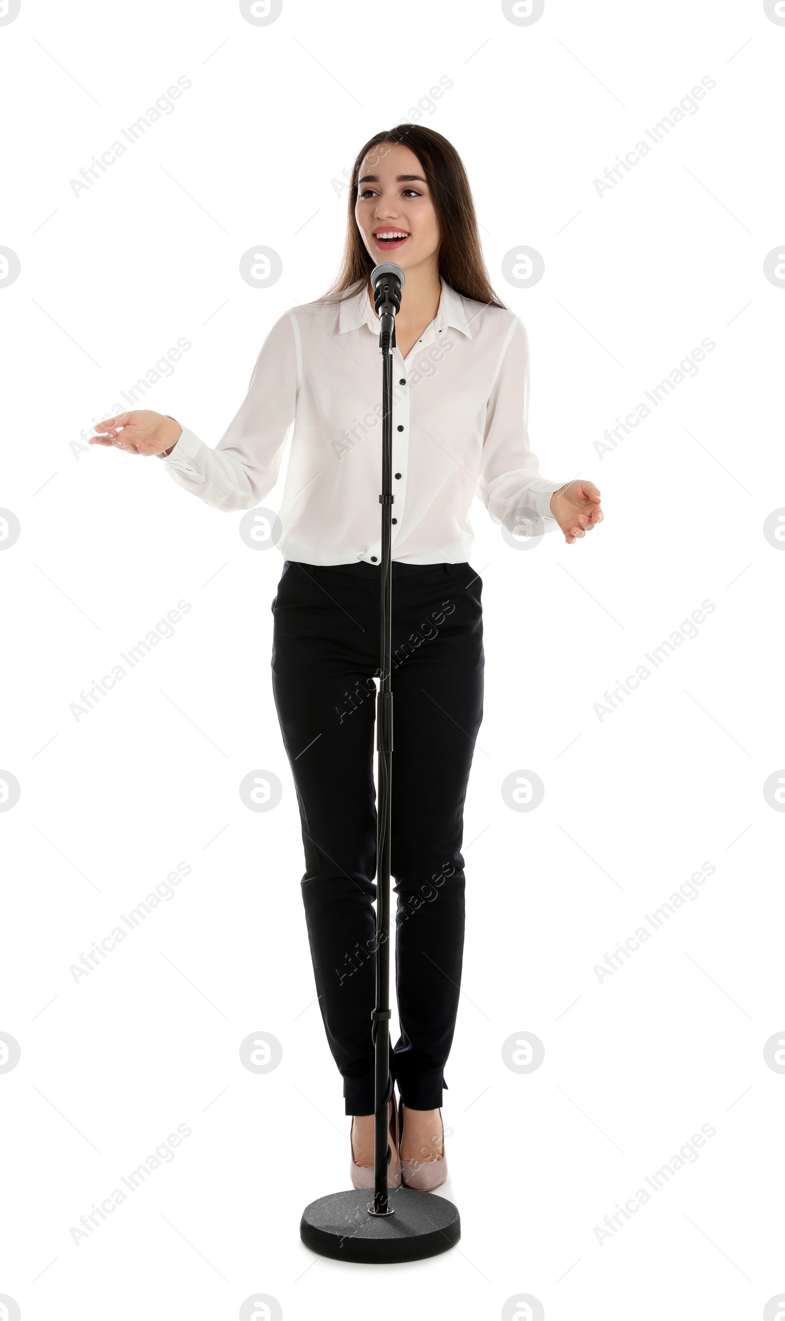 Photo of Young stylish woman with microphone on white background