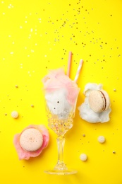 Photo of Flat lay composition with sweet cotton candy on yellow background