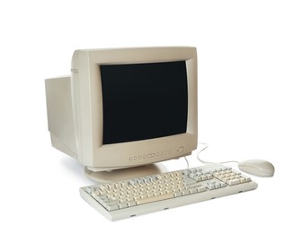 Old computer monitor, keyboard and mouse on white background