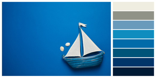 Toy ship on bright background, top view with space for text. Color of the year 2020 (Classic blue)