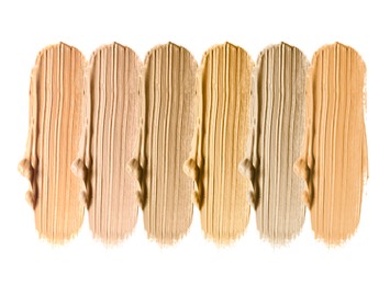 Image of Foundation of various shades for different skin tones isolated on white, top view. Set of samples