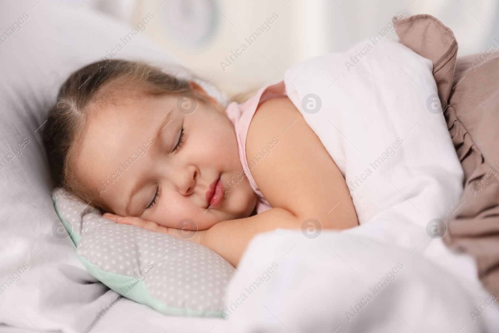 Photo of Cute little girl sleeping at home. Bedtime schedule