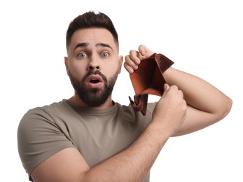 Photo of Confused man showing empty wallet on white background