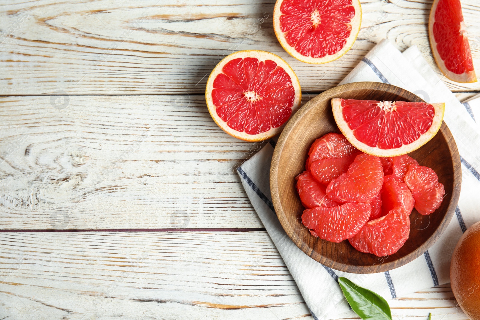 Photo of Flat lay composition with grapefruits and space for text on wooden background