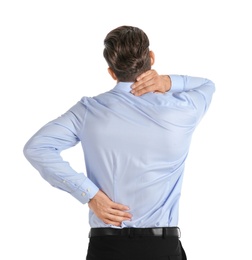 Photo of Young man suffering from back pain on white background