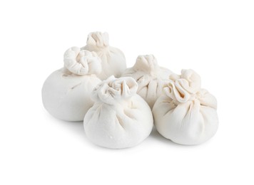 Photo of Uncooked khinkali (dumplings) isolated on white. Georgian cuisine