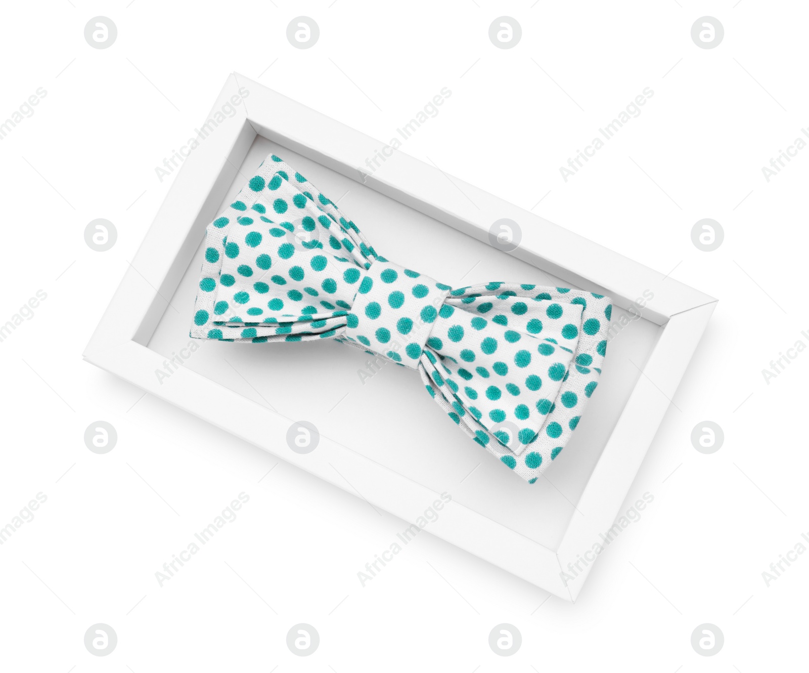 Photo of Stylish bow tie with green polka dot pattern on white background, top view