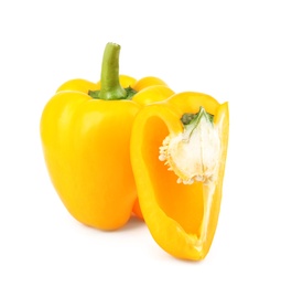 Photo of Whole and cut yellow bell peppers isolated on white