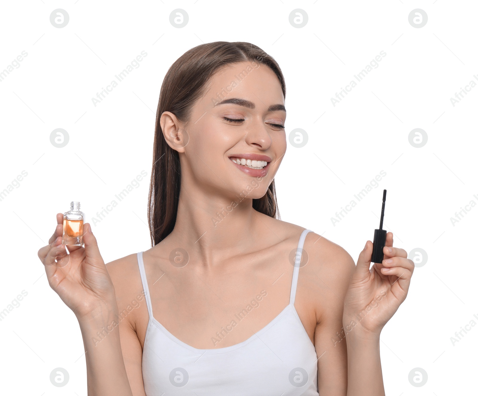 Photo of Young woman with eyelash oil on white background