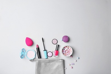 Photo of Decorative makeup products on light background