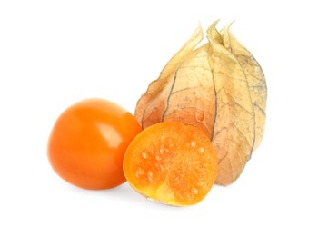 Cut and whole physalis fruits with dry husk on white background
