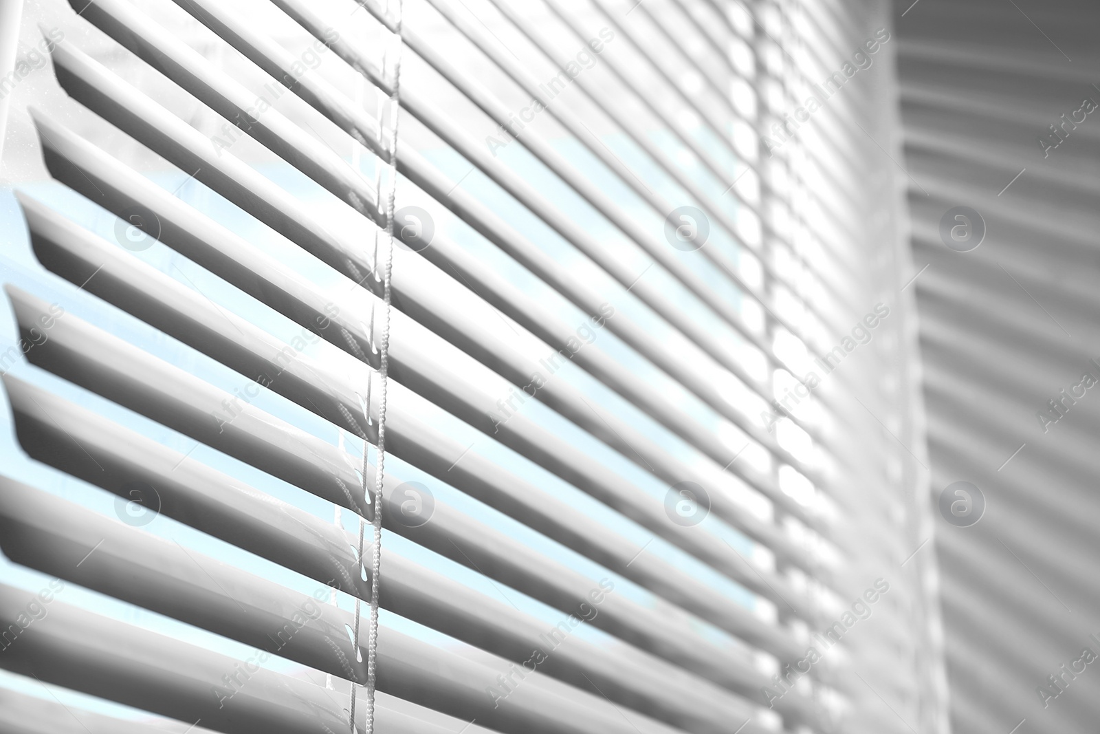 Photo of Closeup view of window with horizontal blinds, low angle view