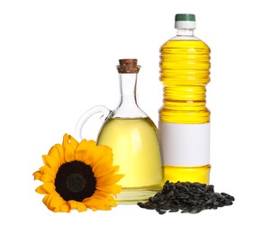 Photo of Sunflower cooking oil, seeds and yellow flower on white background