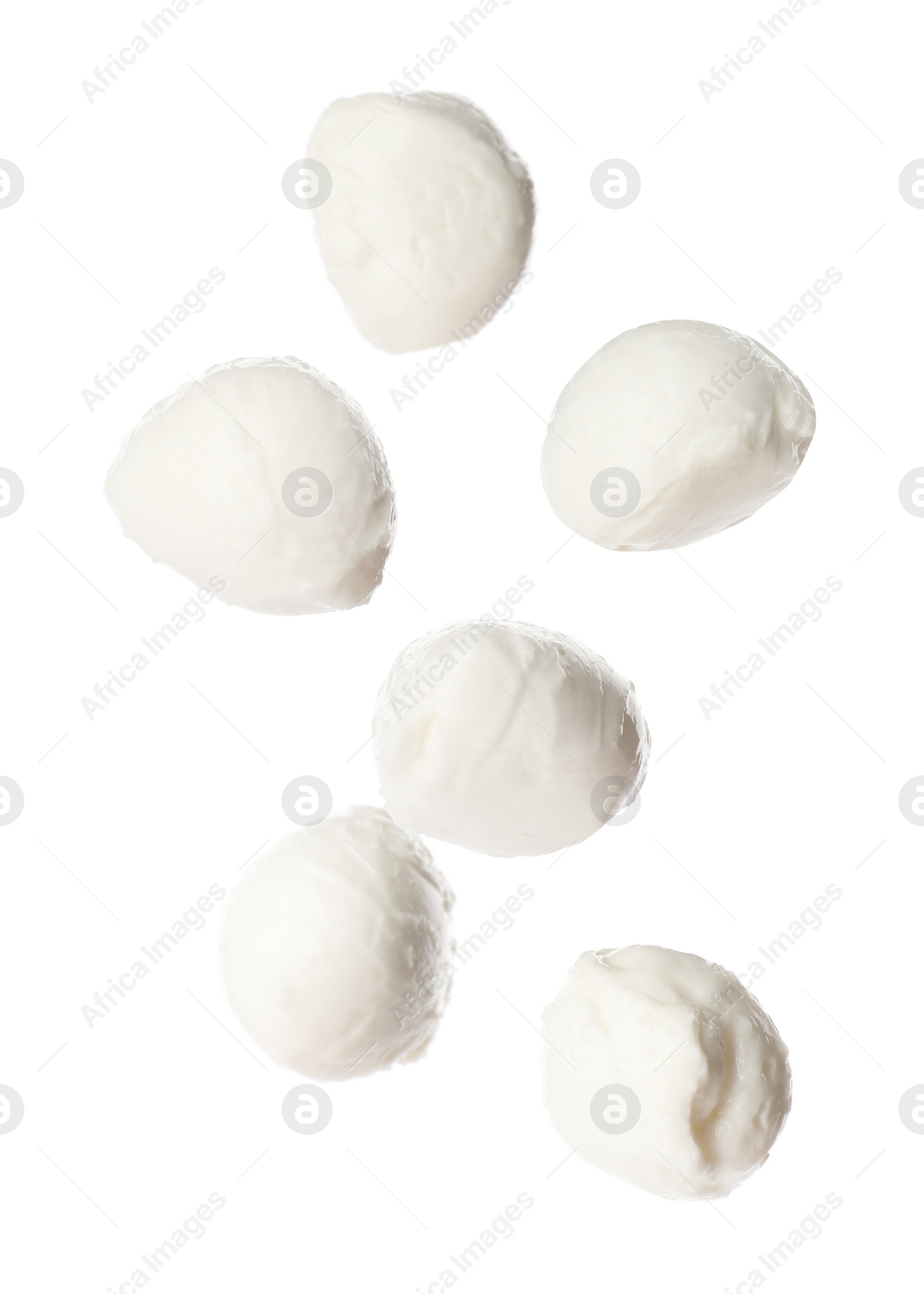 Image of Mozzarella cheese balls falling on white background