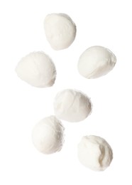 Image of Mozzarella cheese balls falling on white background