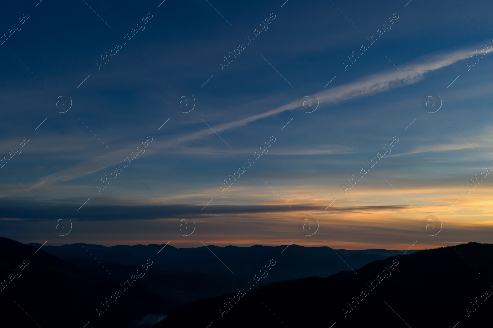 Image of Silhouette of mountain landscape at sunset. Drone photography