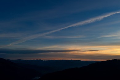 Image of Silhouette of mountain landscape at sunset. Drone photography