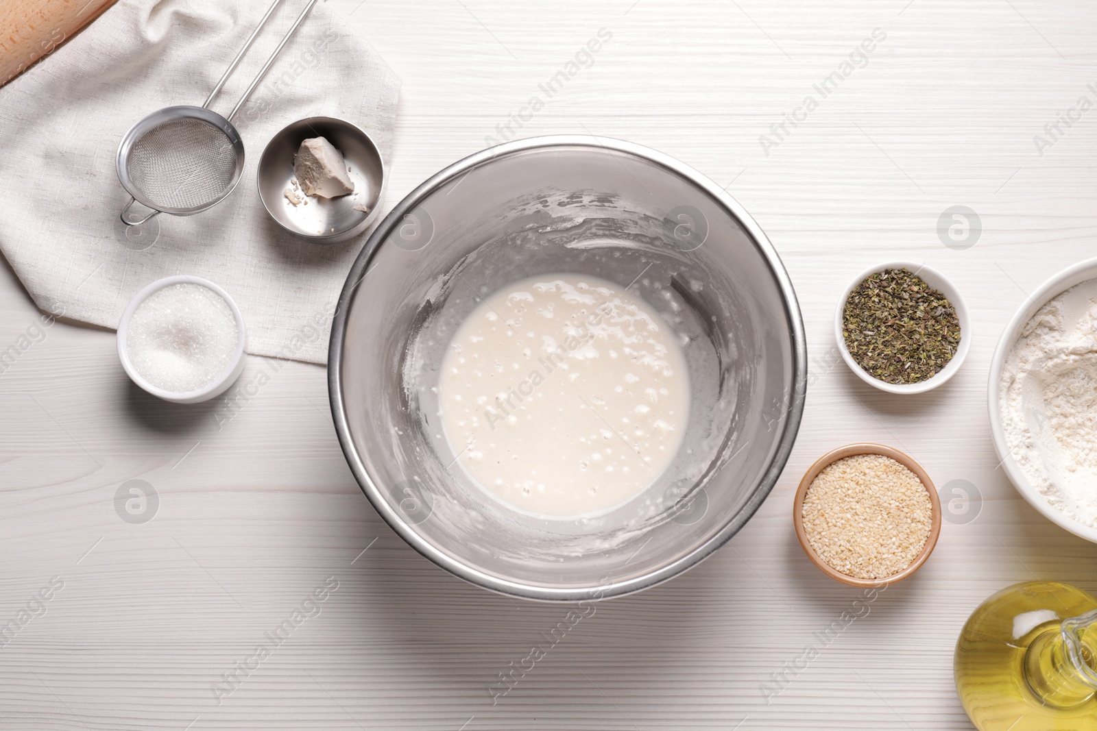 Photo of Cooking grissini. Different ingredients on white wooden table, flat lay
