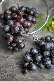 Photo of Composition with fresh ripe juicy grapes on table