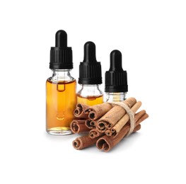 Image of Bottles of natural essential oil and dry cinnamon sticks on white background