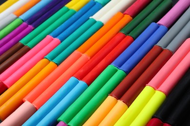 Many different colorful plasticine pieces as background, closeup