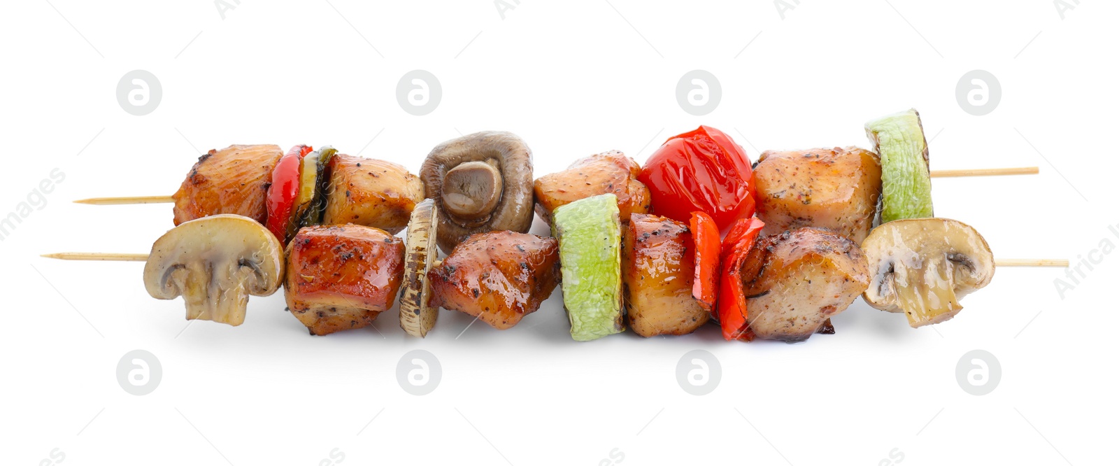 Photo of Delicious shish kebabs with mushrooms, tomato and zucchini isolated on white
