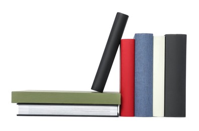 Photo of Many different hardcover books on white background