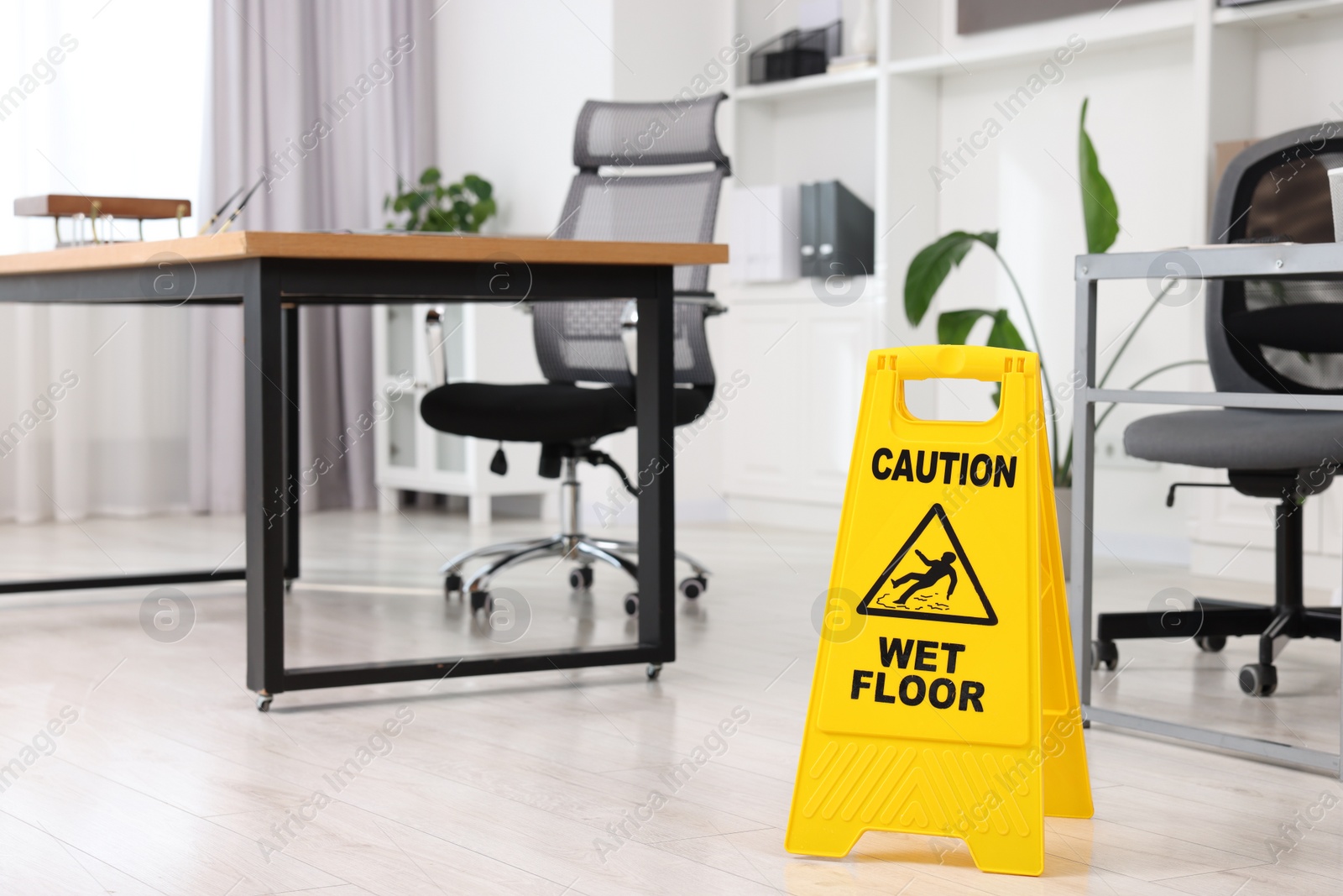 Photo of Cleaning service. Wet floor sign in office, space for text