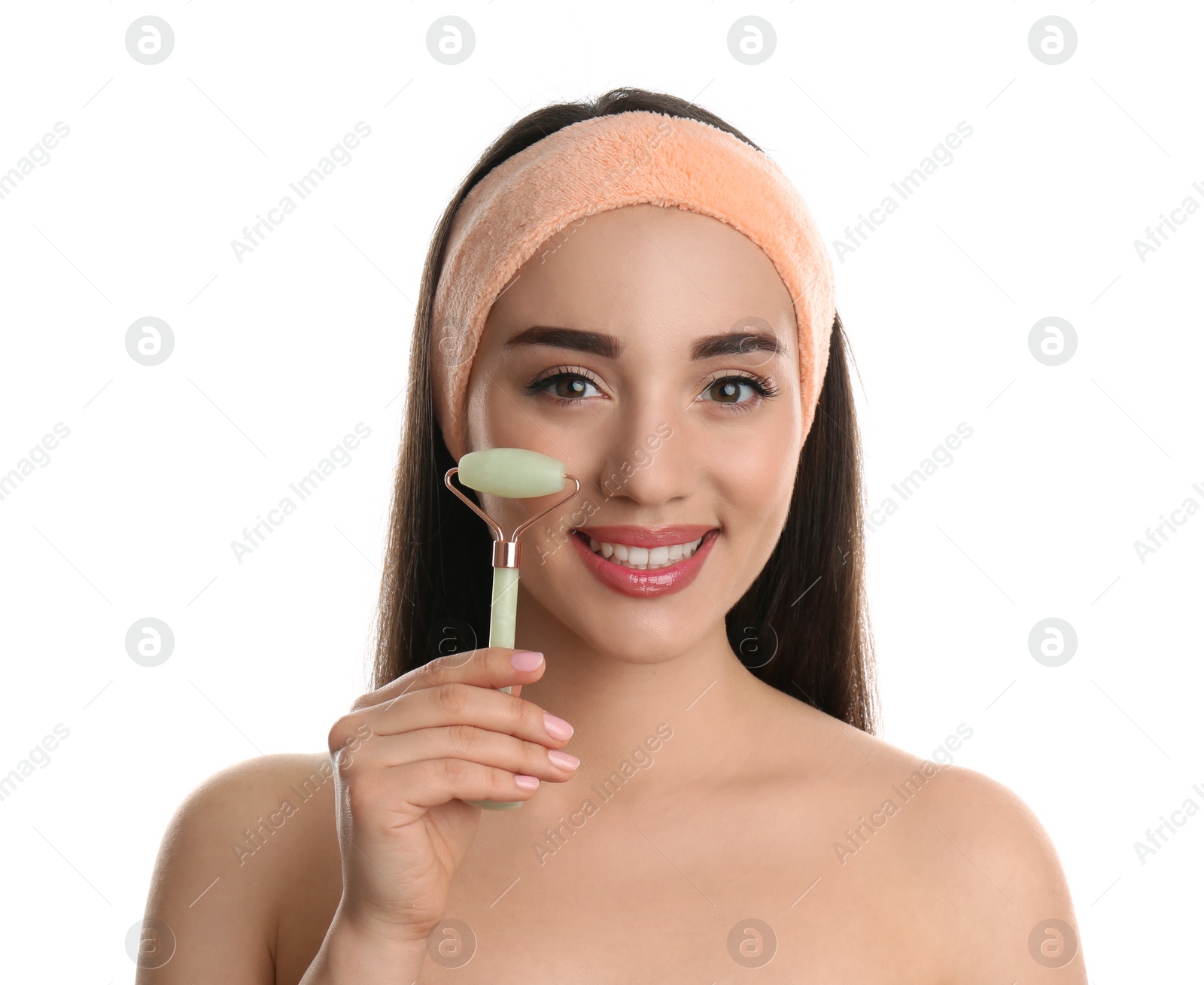 Photo of Woman using natural jade face roller on white background