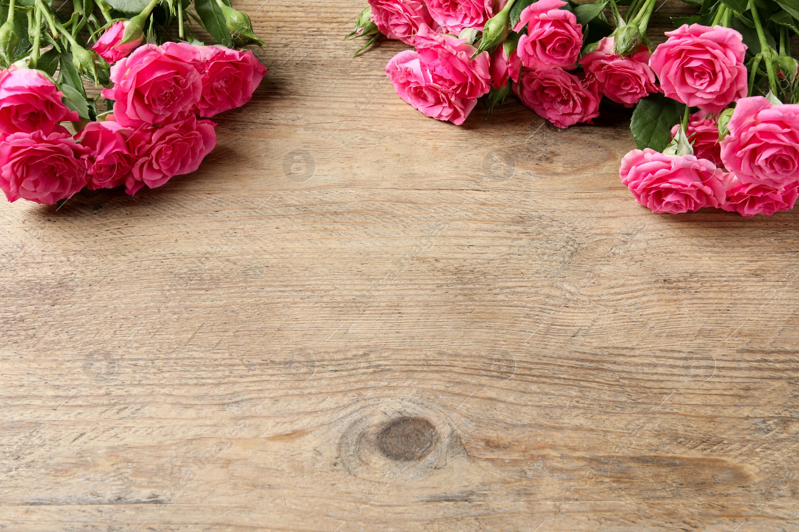 Photo of Happy Mother's Day. Beautiful flowers on wooden table, space for text