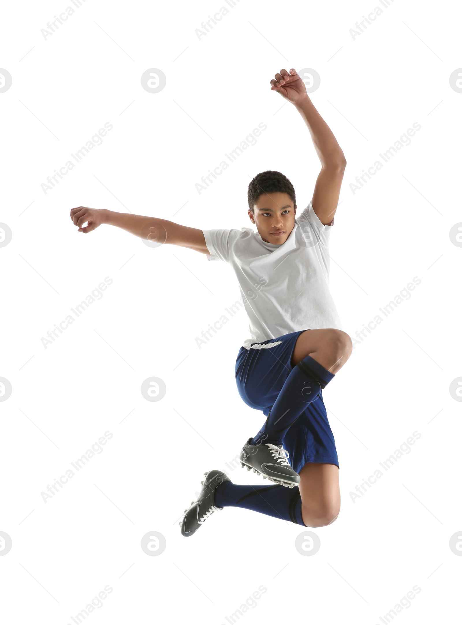 Photo of Teenage African-American boy playing football on white background