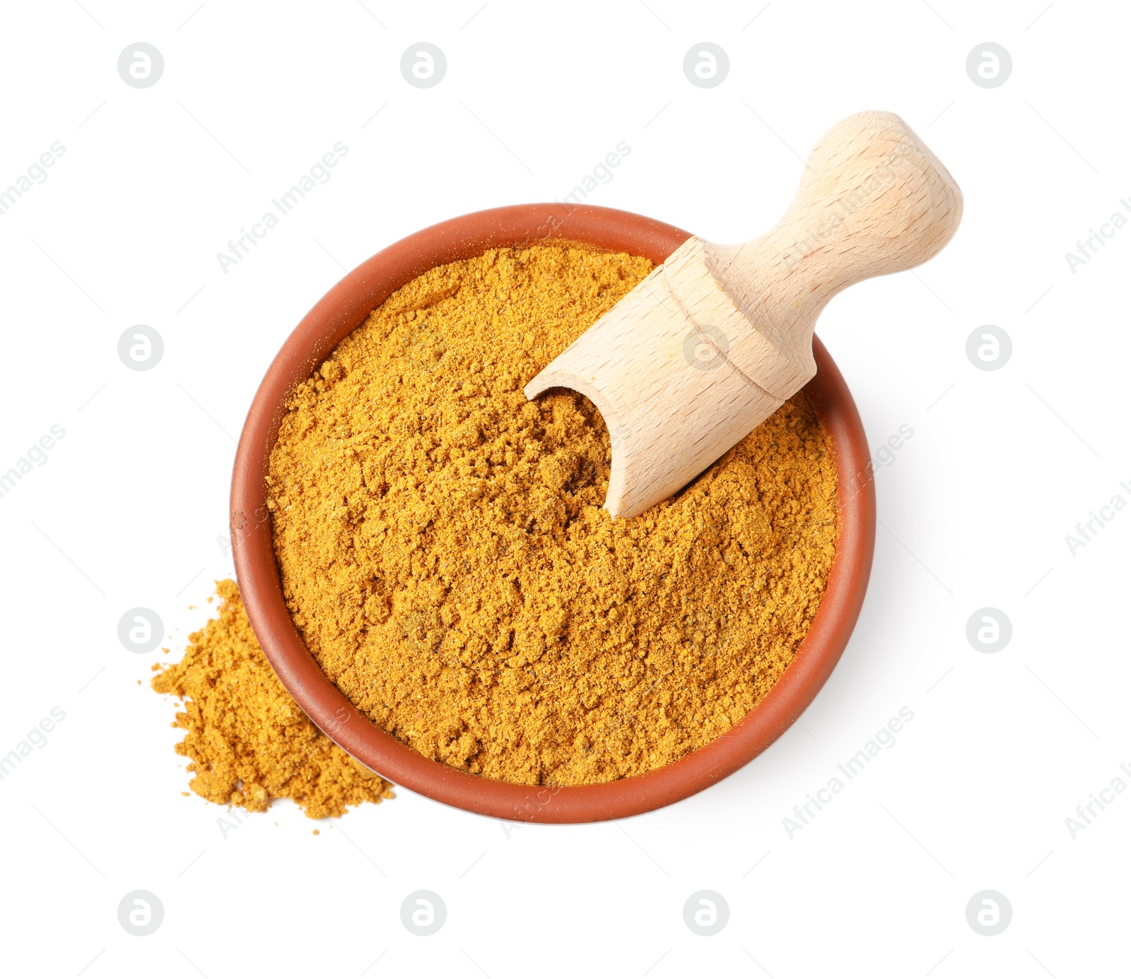 Photo of Curry powder in bowl and scoop isolated on white, top view