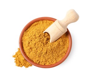 Photo of Curry powder in bowl and scoop isolated on white, top view