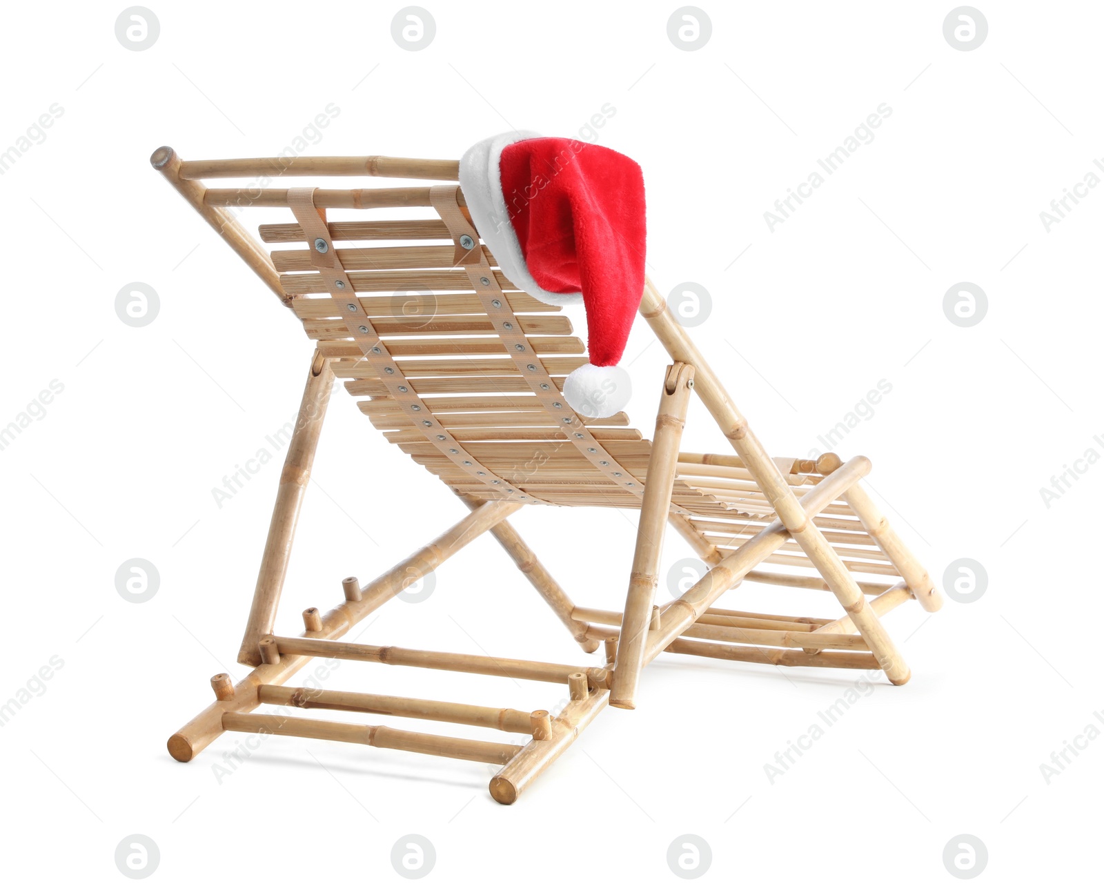 Photo of Wooden deck chair and Santa Claus hat on white background. Christmas vacation