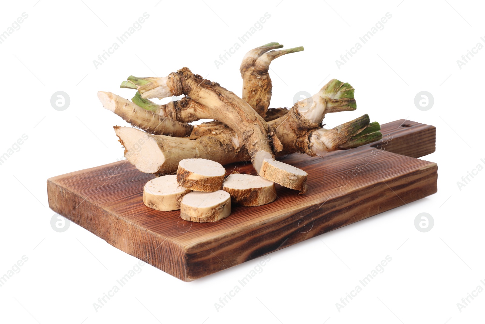 Photo of Board with fresh cut horseradish roots isolated on white
