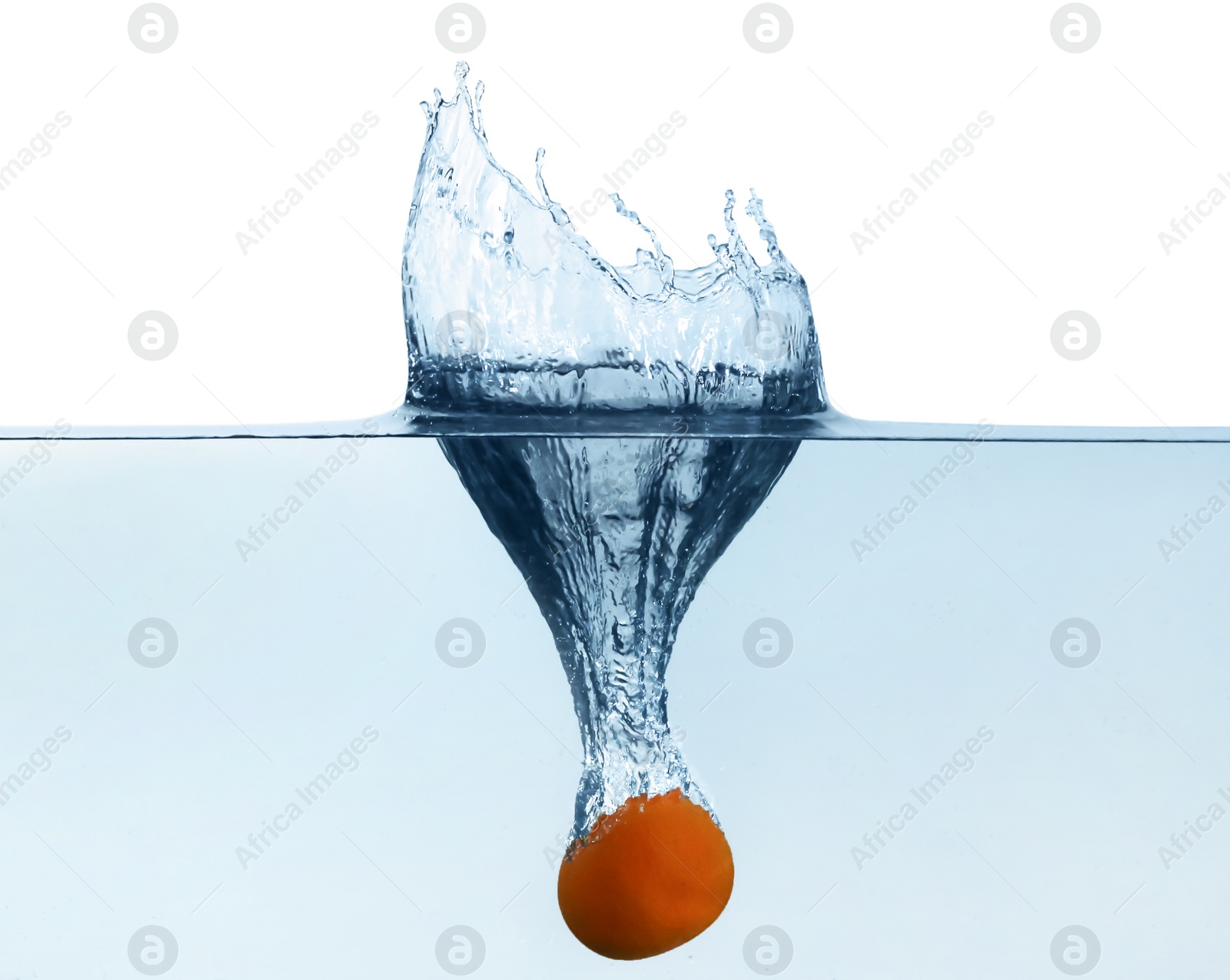 Photo of Tangerine falling down into clear water with splashes against light background
