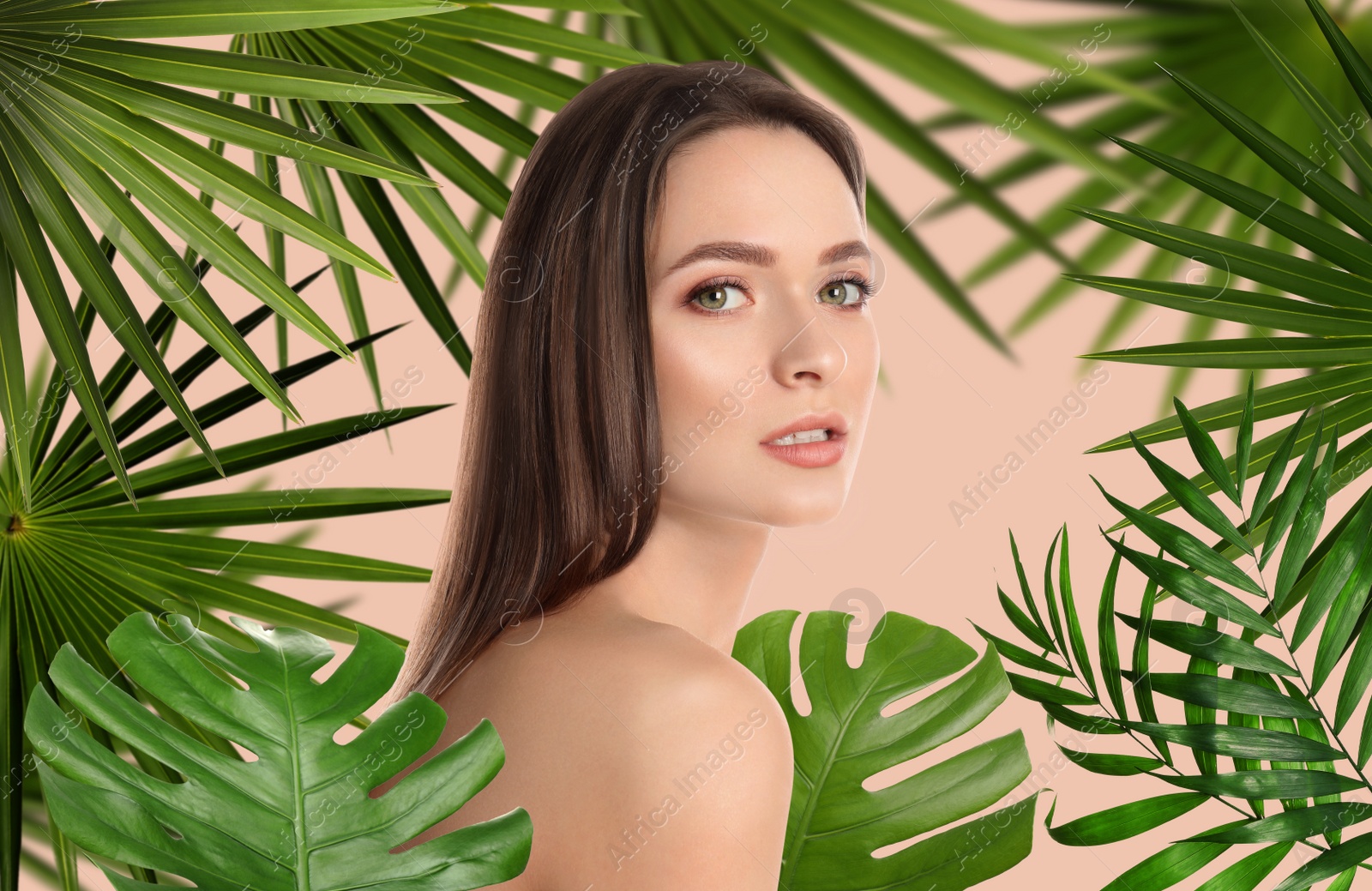 Image of Beautiful young woman and tropical leaves. Spa portrait