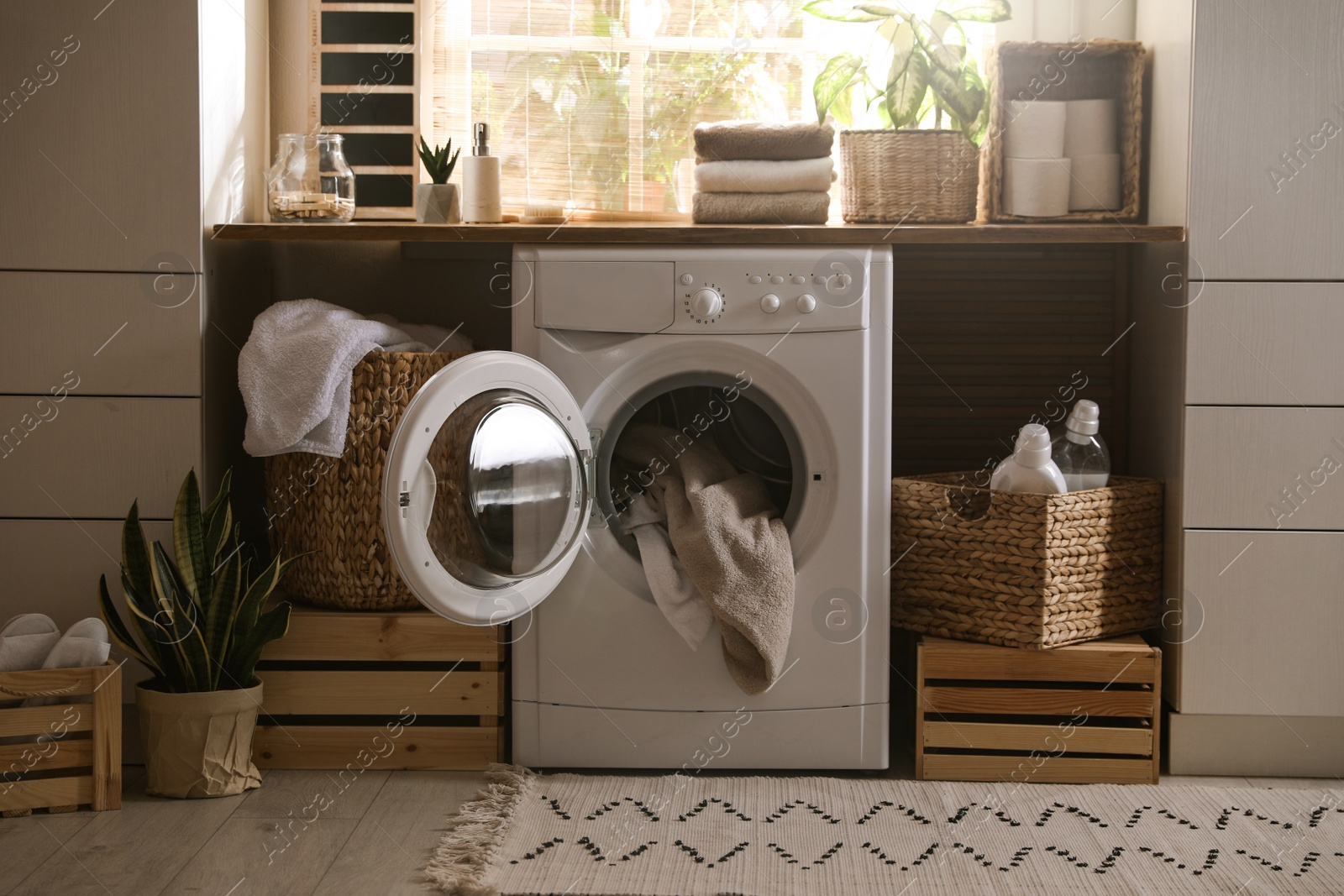 Photo of Stylish room interior with washing machine. Design idea