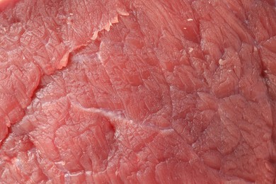 Piece of raw beef meat as background, closeup