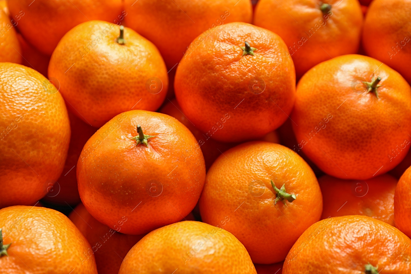 Photo of Delicious fresh ripe tangerines as background, closeup