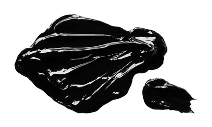 Blots of black paint on white background, top view