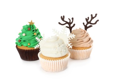 Different beautiful Christmas cupcakes on white background