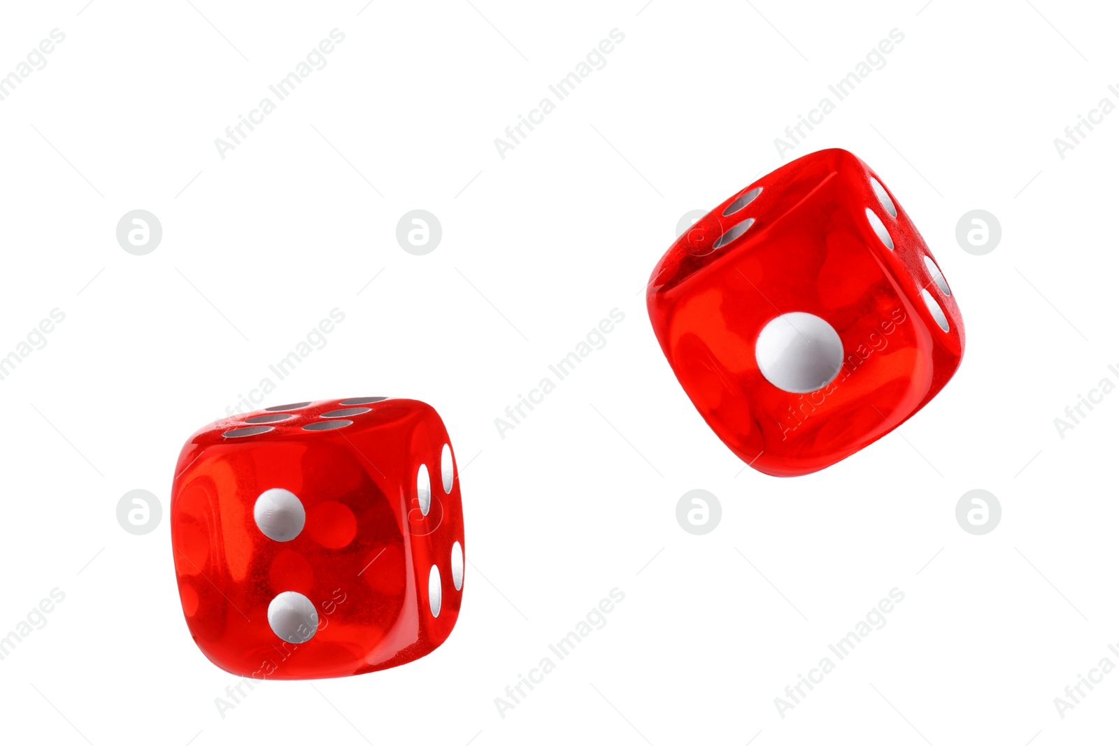 Image of Two red dice in air on white background