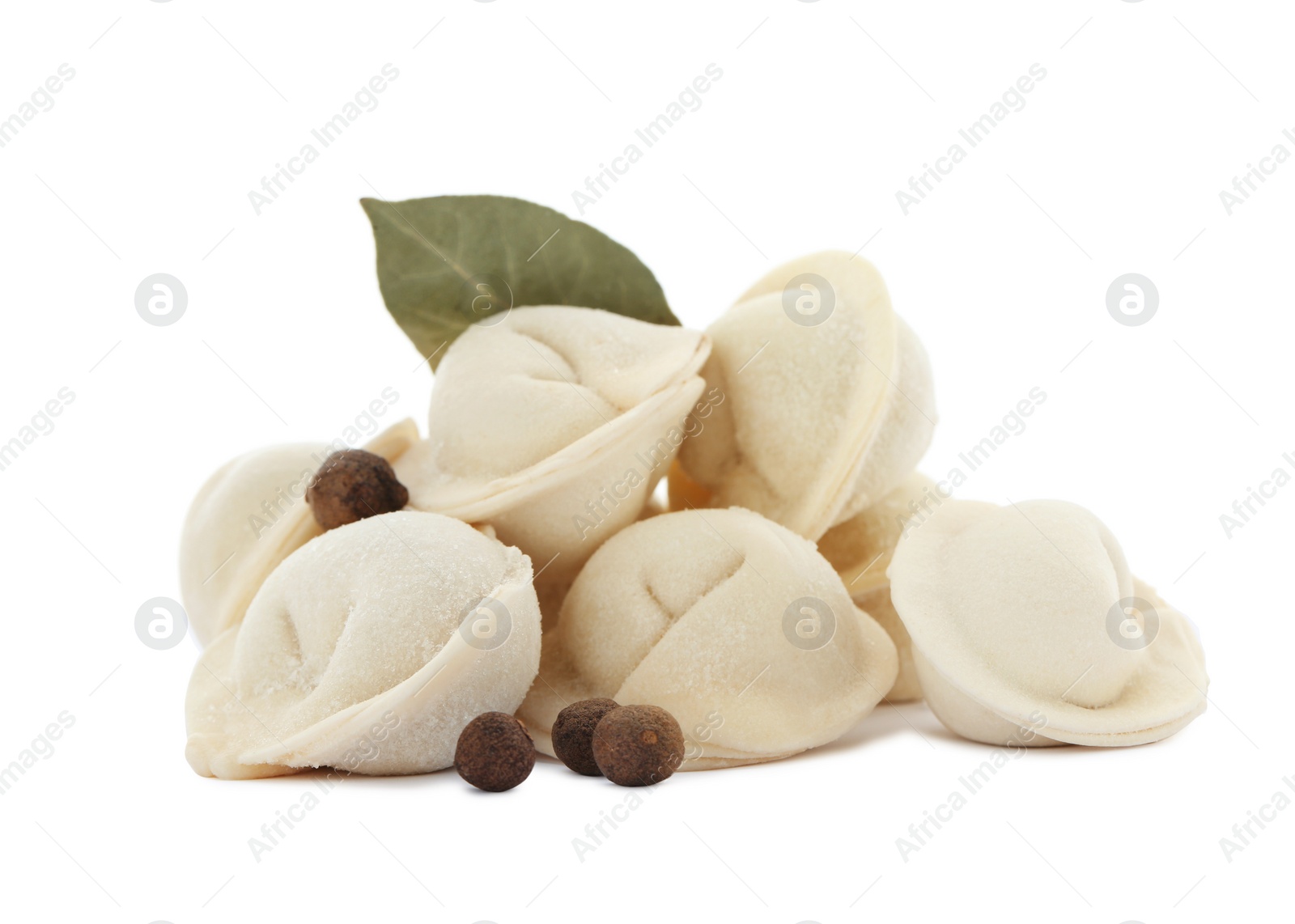 Photo of Raw meat dumplings with bay leaf and pepper on white background