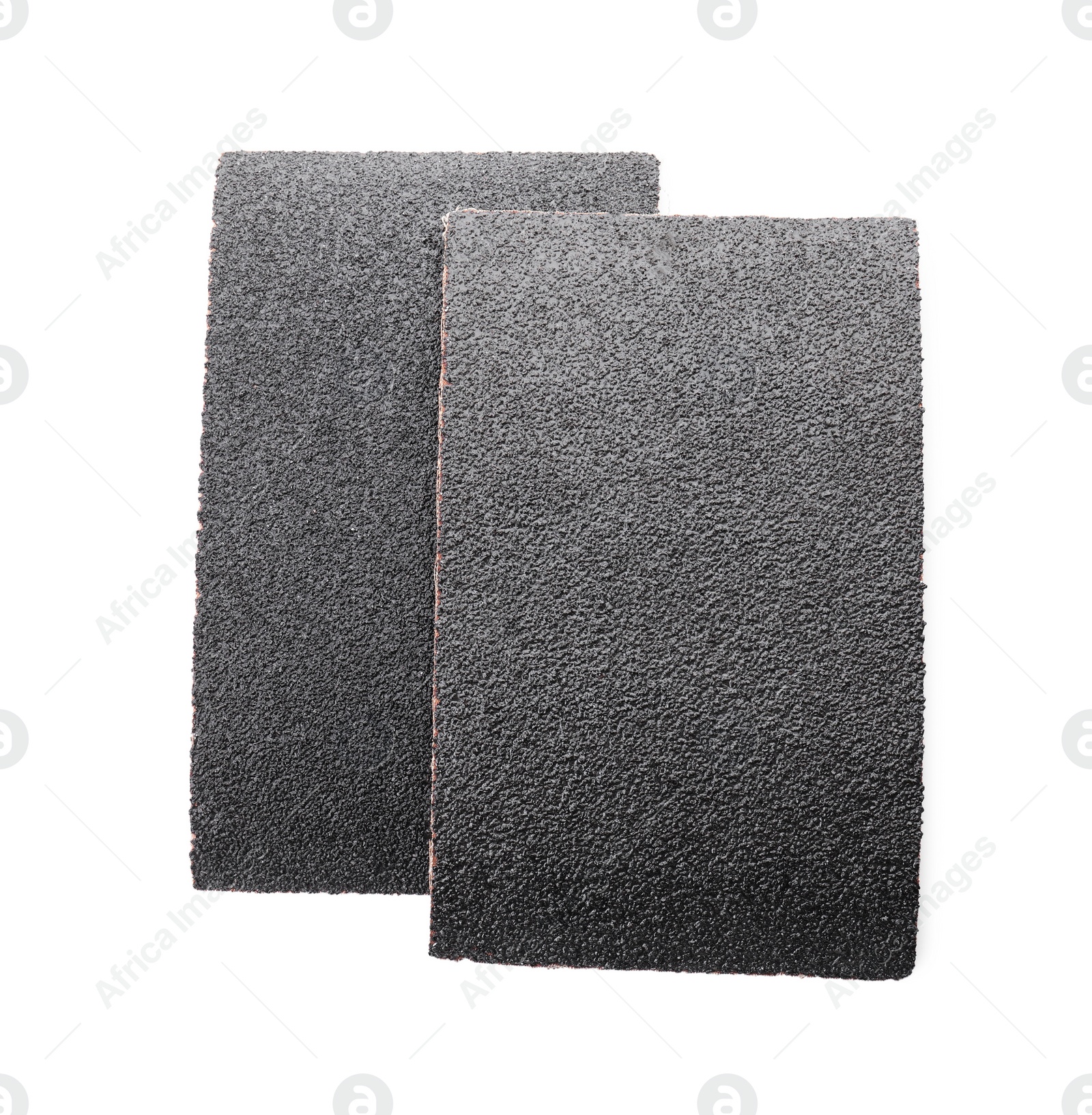 Photo of Two sheets of sandpaper isolated on white, top view