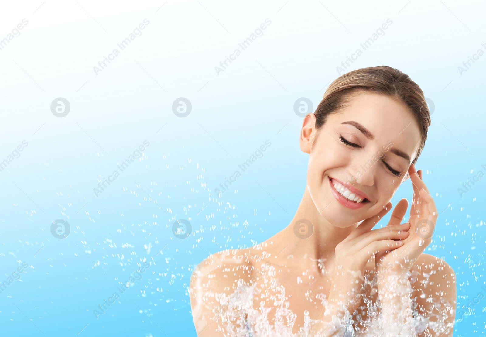 Image of Portrait of beautiful young woman with perfect moisturized skin and splashing water, space for text