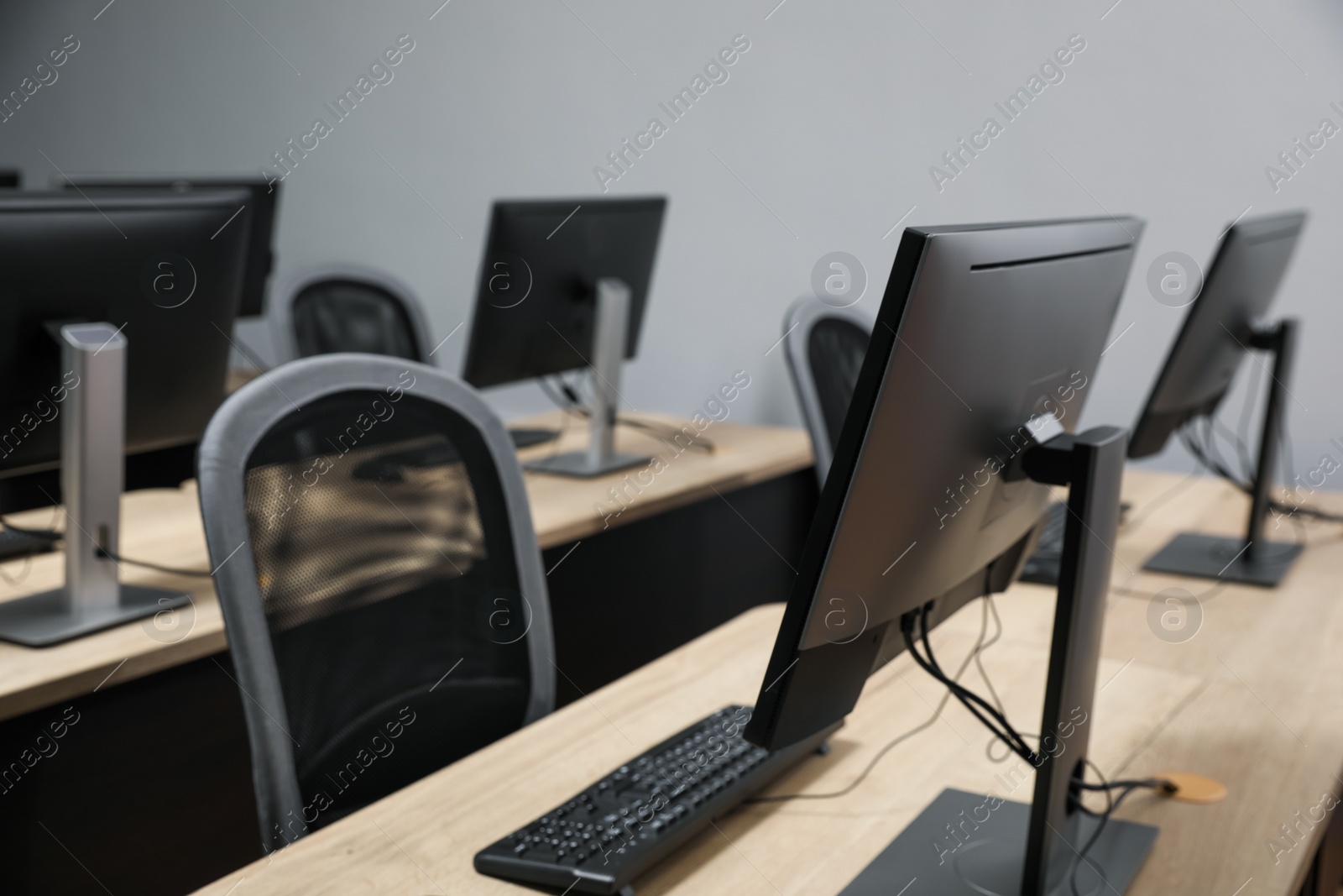 Photo of Many modern computers in open space office