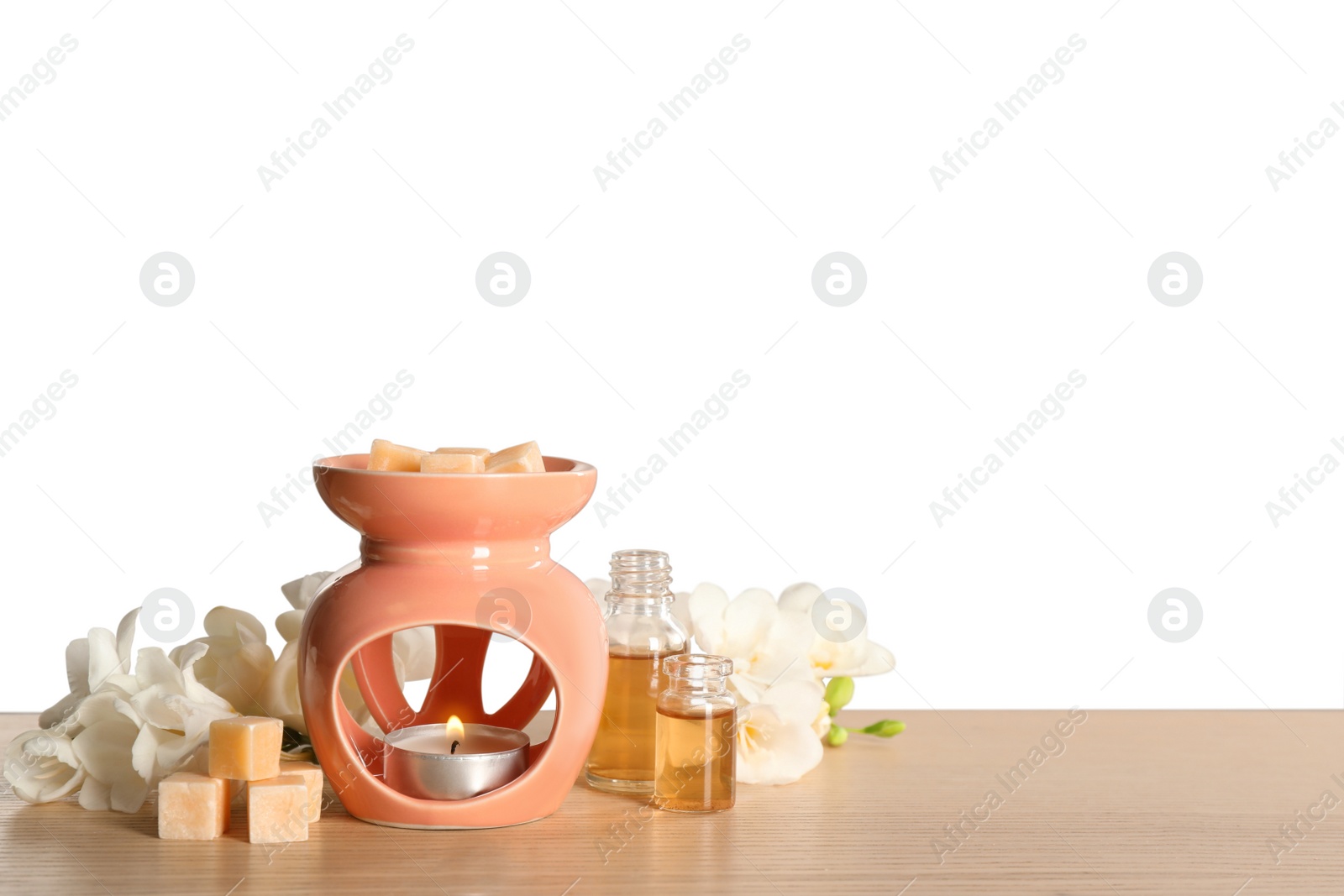 Photo of Composition with aroma lamp on wooden table against light grey background, space for text